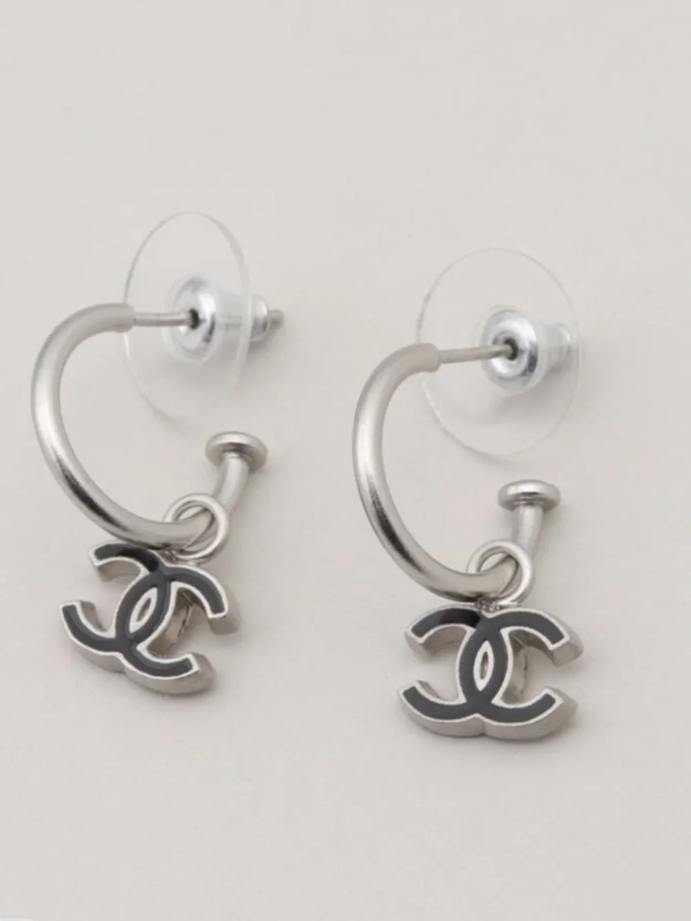 CHANEL Pierced Silver Hoop Earrings with Black CC Charm